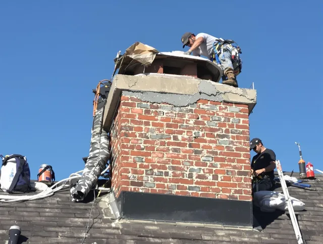 Jerome Chimney Sweep installing a custom chimney crown in Jerome, OH
